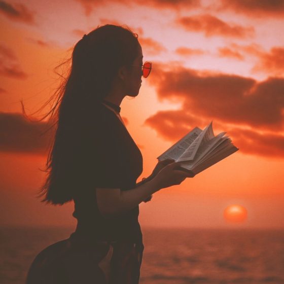 woman reading at dusk